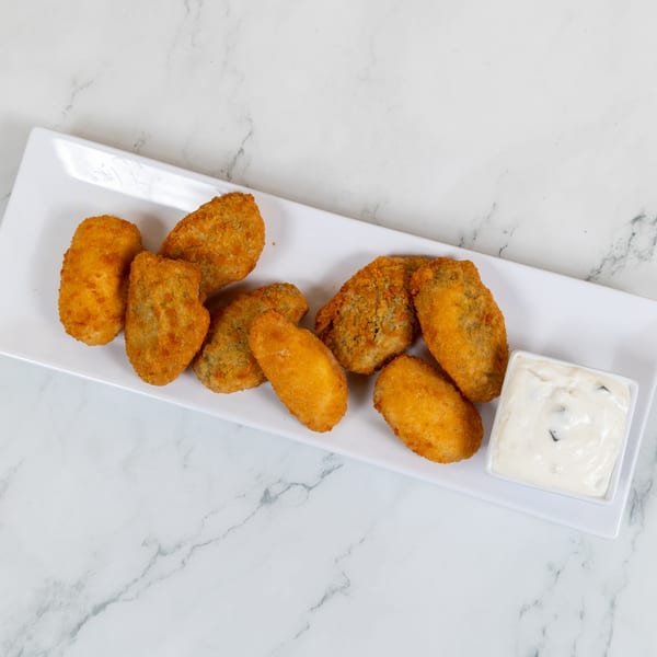 Crispy fried jalapeño poppers and golden mozzarella sticks served with a side of creamy dip.