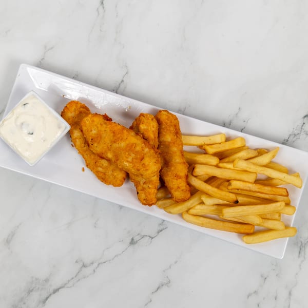 Golden-brown fried fish strips and french fries with a side of tartar sauce on a white rectangular plate.