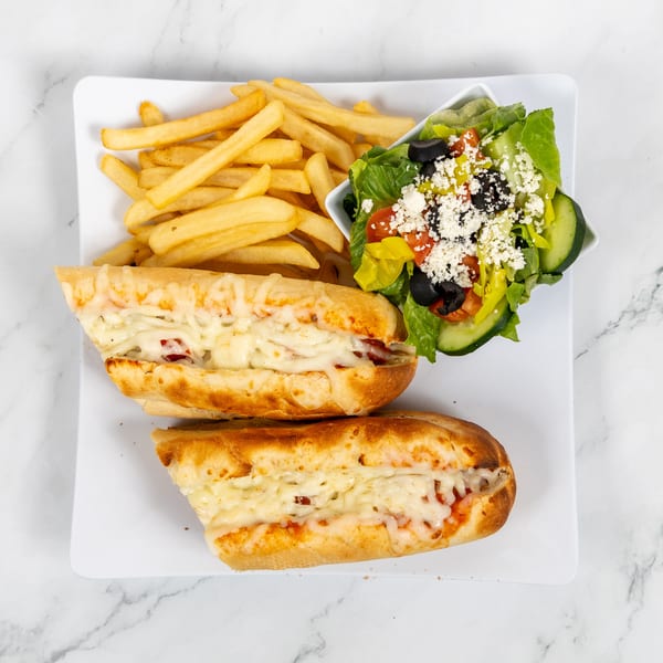 Two cheesy subs with fries and a side salad with feta, olives, and cucumbers.